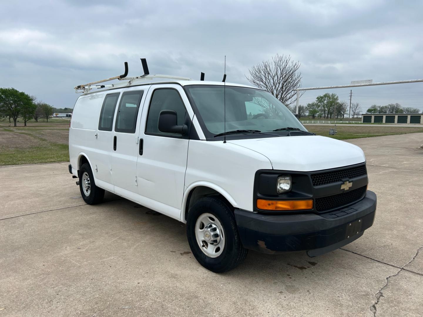 2011 White /Gray Chevrolet Express 2500 Cargo (1GCWGFCB9B1) with an 3.6L V6 DOHC 16V engine, 4-Speed Automatic transmission, located at 17760 Hwy 62, Morris, OK, 74445, (918) 733-4887, 35.609104, -95.877060 - 2011 CHEVY EXPRESS HAS THE 3.6L V6 ENGINE. THIS IS A DEDICATED CNG (ONLY RUNS ON COMPRESSED NATURAL GAS). MANUAL SEATS, MANUAL LOCKS, MANUAL, MIRRORS, MANUAL WINDOWS, AMFM STEREO, A/C, LEATHER SEATS, LEATHER-WRAPPED STEERING WHEEL, TRACTION CONTROL, LOCKING METAL CONSOLE, STEEL SHELVES, SPLIT SWING- - Photo#2